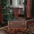 Load image into Gallery viewer, Decorative wood and brass chest on a patterned rug with a Christmas tree in the background
