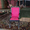 Load image into Gallery viewer, Chair with a red upholstered seat cushion in an ornate room with a bed and rug.