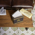 Load image into Gallery viewer, Miniature book 'The Divine Comedy' on a wooden surface.