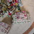 Load image into Gallery viewer, Decorative Christmas presents under a tree with festive decorations.