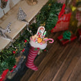Load image into Gallery viewer, Decorative elf figurine with candy cane and gingerbread man on a Christmas-themed background