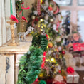 Load image into Gallery viewer, Decorative Christmas scene with a mantel, wreath, and tree in a home setting with a Miniature sterling reindeer stocking holder