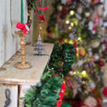 Load image into Gallery viewer, side view of sterling silver Christmas tree stocking holder on mantelpiece