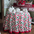 Load image into Gallery viewer, Round table with a floral tablecloth and teacup set in a room with holiday furniture and decor.
