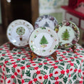 Load image into Gallery viewer, Decorative plates with Christmas tree designs on a floral tablecloth.