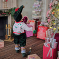 Load image into Gallery viewer, backside view of Elf boy doll carrying jack-in-the-box toy