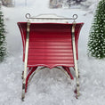 Load image into Gallery viewer, sleigh front in a snowy landscape with evergreen trees.