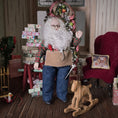Load image into Gallery viewer, Dollhouse Doll Santa Claus with a long white beard and tool belt in a festive room with Christmas decorations