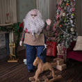 Load image into Gallery viewer, Dollhouse Doll Santa Claus with a long white beard and tool belt, standing in a room with a Christmas tree and presents.