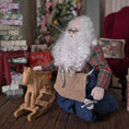 Load image into Gallery viewer, Dollhouse Doll Santa Claus with a long white beard and tool belt, with a rocking horse in a festive setting