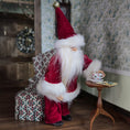 Load image into Gallery viewer, Decorative Santa Claus dollhouse doll in a cozy room with floral wallpaper.