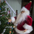 Load image into Gallery viewer, Santa Claus dollhouse doll next to a decorated Christmas tree indoors.