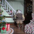 Load image into Gallery viewer, Old Christmas Elf doll in a festive room with Christmas decorations and presents.