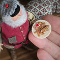 Load image into Gallery viewer, Old Christmas Elf doll with gingerbread cookies on a round plate held by a hand.