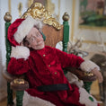 Load image into Gallery viewer, Santa dollhouse doll in a red outfit sitting on an ornate chair.