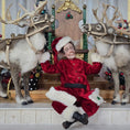 Load image into Gallery viewer, Santa dollhouse doll in a red costume with reindeer in a festive setting