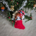 Load image into Gallery viewer, back side of miniature dollhouse stocking with a dolly inside