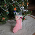 Load image into Gallery viewer, filled miniature Decorative pink stocking in front of a christmas tree