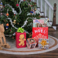 Load image into Gallery viewer, Decorative Christmas scene with small presents and a tree in a home setting