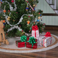 Load image into Gallery viewer, Small Christmas presents with ribbons in front of a decorated tree.