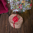 Load image into Gallery viewer, oval miniature dollhouse hat box with a red ribbon, and a Christmas tree in the background