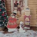 Load image into Gallery viewer, Dollhouse miniature Wooden Christmas decorations including a snowman, Santa, and a snowman with 'Joy' on its coat, in front of a decorated Christmas tree.