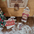 Load image into Gallery viewer, Dollhouse miniature Decorative Christmas figures on a wooden porch with a small tree in the corner.