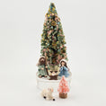 Load image into Gallery viewer, Decorative Christmas scene with a tree, nativity figures, and a small pink tree on a white background.