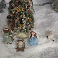 Load image into Gallery viewer, Nativity scene with figures and a decorated Christmas tree in a snowy setting miniature dollhouse