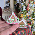 Load image into Gallery viewer, Pair miniature dollhouse gingerbread houses, one is held in. hand