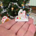 Load image into Gallery viewer, miniature gingerbread house held on hand