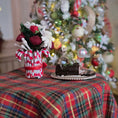 Load image into Gallery viewer, vase of flowers, yule log cake on table near tree