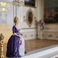 Load image into Gallery viewer, Gale Elena Bantock doll in a purple dress standing in an ornate room.