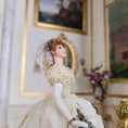 Load image into Gallery viewer, side view of Stacy Hoffman doll with paintings and a mirror.