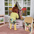 Load image into Gallery viewer, Catherine Muniere doll in a warm sweater standing in a playroom
