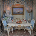 Load image into Gallery viewer, Miniature pastries on wooden serving board, set on a table in an ornate room