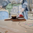 Load image into Gallery viewer, Cup of coffee and dessert on a wooden board with decorative background
