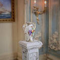 Load image into Gallery viewer, Decorative vase on a pedestal in an elegant room with a painting and candlestick in the background.