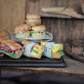 Load image into Gallery viewer, Miniature sandwiches on a rustic wooden surface with a blurred background