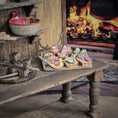 Load image into Gallery viewer, Small table with food in front of a fireplace