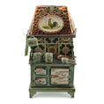 Load image into Gallery viewer, Decorative miniature stove with rooster design on the lid, surrounded by mugs and a teapot.