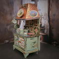Load image into Gallery viewer, Decorative kitchen stove with items in a vintage setting
