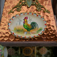 Load image into Gallery viewer, Decorative plate with a rooster design on a textured surface