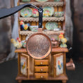 Load image into Gallery viewer, Close-up of a copper frying pan with a blurred kitchen setting in the background
