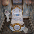 Load image into Gallery viewer, Decorative bed with gold and blue accents in an ornate room.