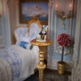 Load image into Gallery viewer, Decorative figurine on a gold pedestal in a miniature room setting