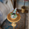 Load image into Gallery viewer, Decorative figurine on a gold stand with a blurred background