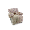 Load image into Gallery viewer, Floral patterned armchair with a beige blanket on a white background