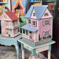 Load image into Gallery viewer, Laura Eppich 1:144 Lavender & Blue Three-Story Victorian Dollhouse on Blue Table