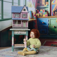 Load image into Gallery viewer, Laura Eppich 1:144 Lavender & Blue Three-Story Victorian Dollhouse on Blue Table